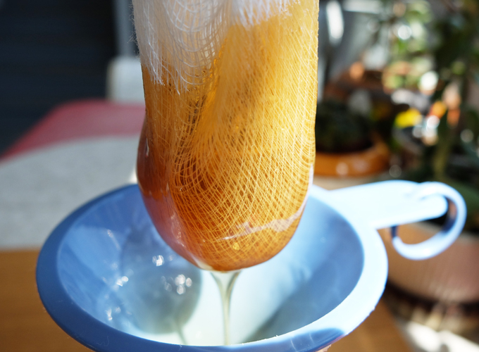 Lavender Honey through a Cheese Cloth